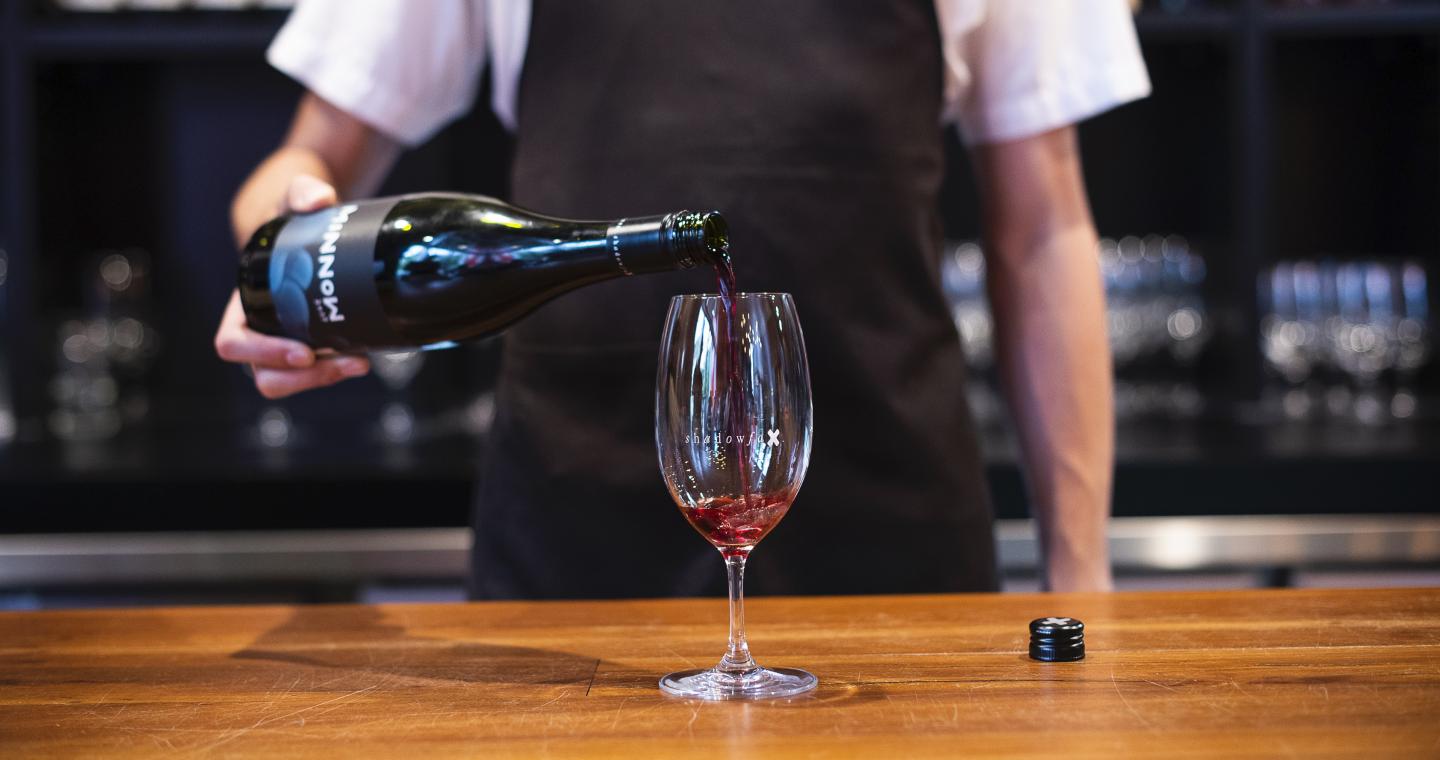 Pouring wine at Shadowfax cellar door