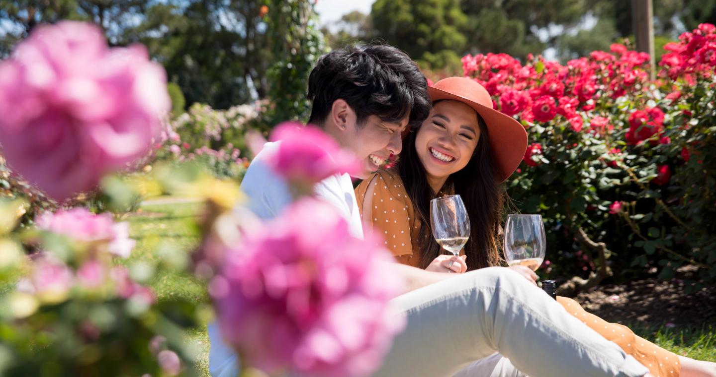 Couple having wine in the Victoria State Rose Garden