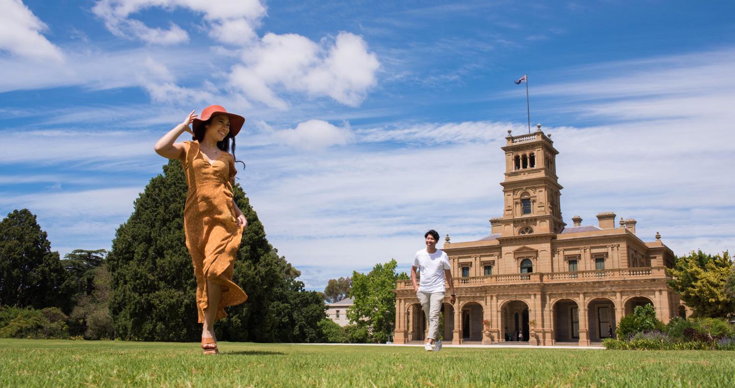 Couple on the lawn at Werribee Park Mansion