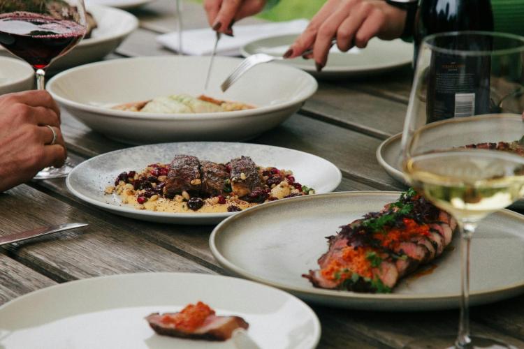food and wine at the dinner table