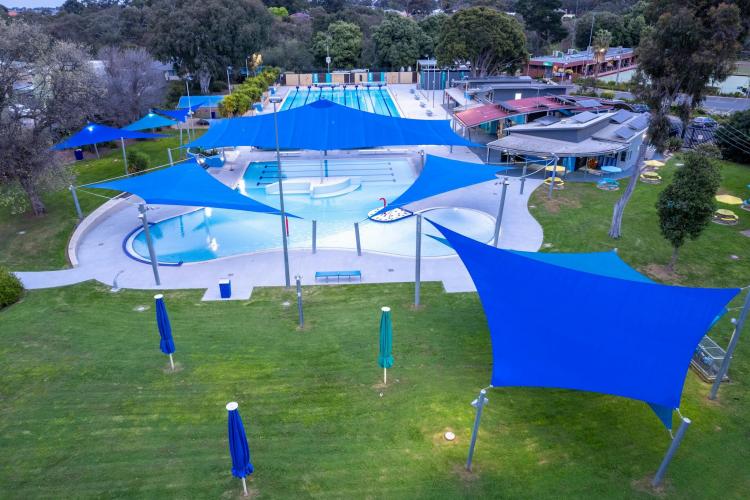 aerial of Werribee Outdoor Pool showing shade sails and grass lawns