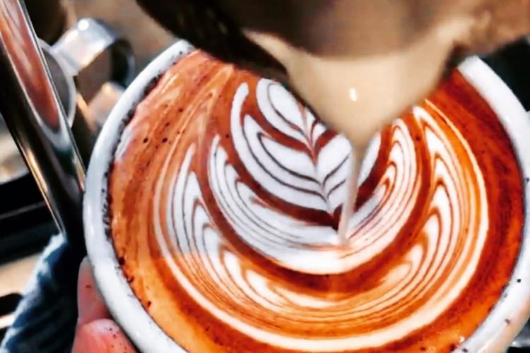 our barista creates beautiful  latte art