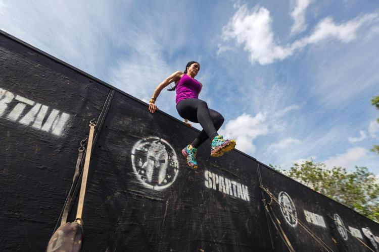 A person competes in Spartan Race.