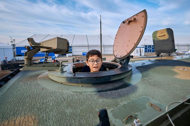 Child in a defence tank