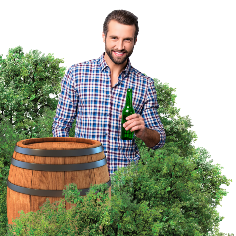 Man drinking a beer at a wine barrel