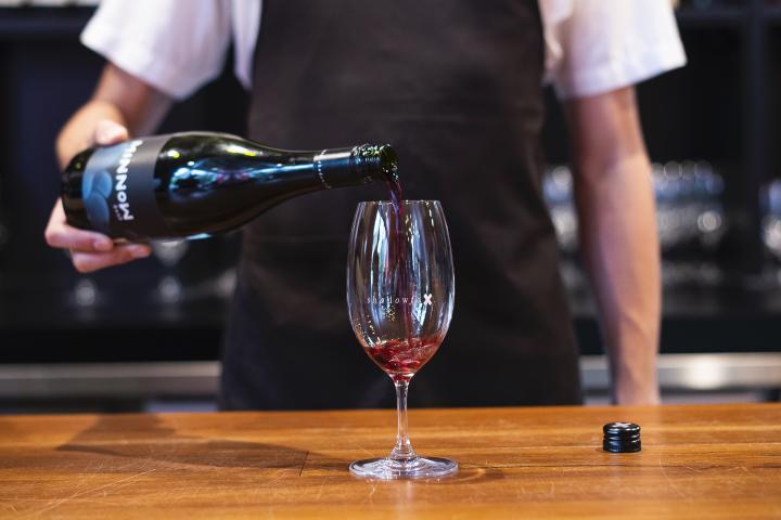 Pouring wine at Shadowfax cellar door